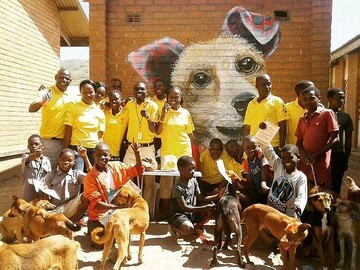 Some of the Mission Rabies team gathered around one of Louis Masai