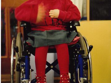 Joanna in her wheelchair - a tumour on her spine caused paralysis in her legs