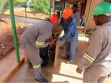 Laying underground cable to wards at Mulanje Mission Hospital