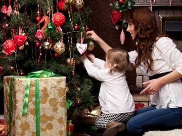 Mum and child at Christmas tree