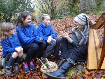 Pupils from Invergarry Primary School with singer and harpist Claire Hewitt