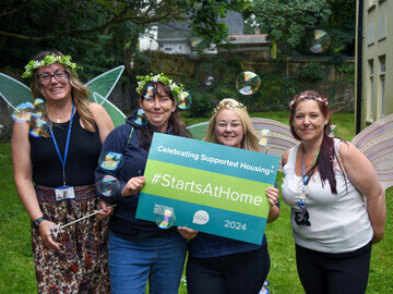 Colleagues get into the spirit ready to help start creating the new fairy garden on Starts at Home day 