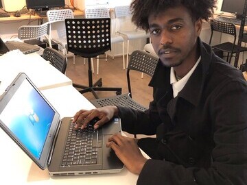 Homeless youth using laptops, ESG