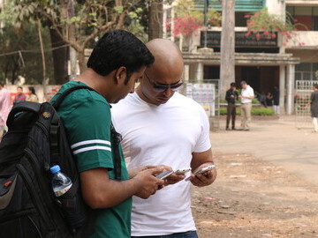Rakibul Islam of YO.com (left); Saju Abraham of YO.com (right) field testing at the University of Dhaka, Bangladesh