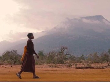 A child walks to school in Kenya