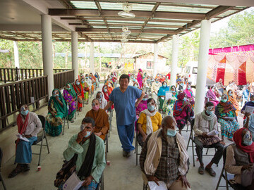 Dr Sanduk Ruit amongst patients at a microsurgical outreach camp to cure blindness at scale.