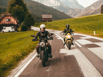 Two of the co-founders on their bikes riding through the Austrian Alps