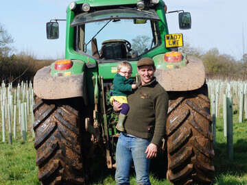 Farmer Mark Chattey with his daughter, who he has named his copse after.