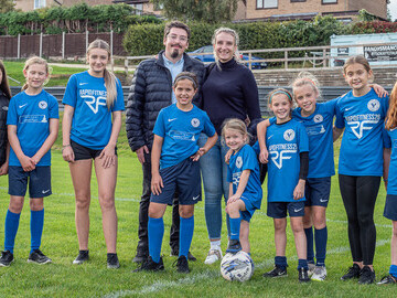 © Halifax FC Women Limited - Daniel Thomas Loitz with his partner and girls of the Halifax FC Women Academy.