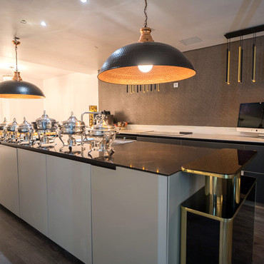 A sophisticated kitchen and dining area at Venue C, designed for both entertaining and everyday indulgence.