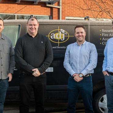 APG team outside of the ADJ offices located in Bolton