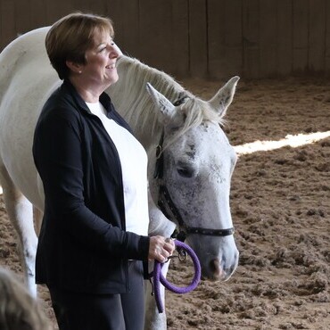 Jacqui Gayle, MBE, CEO of Reframe Cancer with Gaia at the Harness Change Equine Facilitated Learning Corporate Training Workshop in Cumbria 